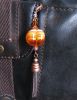 Bijou de sac Ambre et cuivre