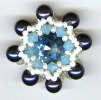 bague en perles nacrées, toupies et cabochon swarovski