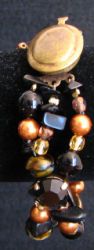 Bracelet Noir & ambre aux cabochons sertis