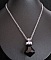 Pendentif  grosse toupie noire Swarovski sur cha&icirc;ne