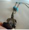 Sautoir pendentif gousset tortue pierres turquoises
