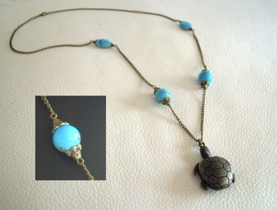 Sautoir pendentif gousset tortue pierres turquoises