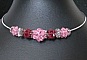 Torques aux boules de perles roses et Bali
